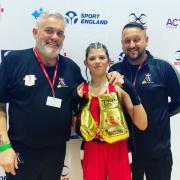 Brooke Matthews with her coaches and Golden Gloves after national victory. Picture: Triple A Boxing Club