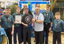 District Commissioner Mel Buck presenting the trophy to 14th Lowestoft.