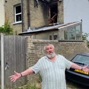 Ian Kirby, 80, pictured outside his home six months after his house went up in flames