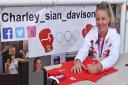 Charley Davison signs a Team GB vest at the special ceremony in Lowestoft.