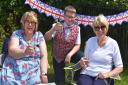 Zoe and Samuel Parle and Lynne Bland toast the Queen