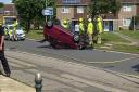 The scene of the crash, with the overturned car on Weston Road, Lowestoft.