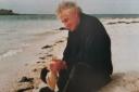 A Scottish holiday: Norfolk County Council's first PR officer and former journalist, Bernard Farrant (pictured on a beach) died aged 87