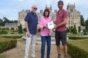 Paul Randle of Beccles Rotary Club is on the left, with Sue in the middle and Head of Gardens Simon Gaches on the right, presenting the voucher certificate.