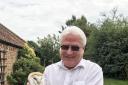 Dr Adrian Parton, chairman and proprietor of Ivy House Country Hotel in Oulton Broad, holding one of the baby barn owls. Picture: Courtesy of Adrian Parton.