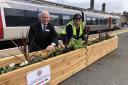 New planters were installed to mark the coronation at Lowestoft Station. Pictured is Greater Anglia customer engagement manager Alan Neville, left, and Lowestoft Station adopter Jacqui Dale