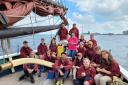Alderman Peel High School  students with the crew aboard Excelsior. Picture:  The Excelsior Trust