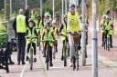 The 'Bike Library' pilot scheme is launched as Phoenix St Peter Academy children and Rotary officials in Lowestoft cycle on the promenade to build on the legacy of the Tour Of Britain. Picture: Mick Howes