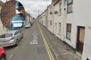 A home on Bevan Street West in Lowestoft was targeted. Inset: A Suffolk Constabulary officer. Pictures: Google Images/Newsquest
