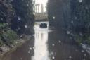 The car attempted to get through the flooded road