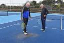 Tennis players assessing the damage to courts at Lowestoft Town Tennis and Pickleball club after oil was thrown onto the courts. Picture: Mick Howes