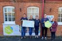 The funds are handed over to the hospice charity