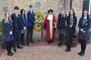 Mayor of Lowestoft Sonia Barker with high school students as wreaths are laid at Lowestoft rail station. Picture: Mick Howes