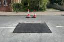 The patched over and repaired sinkhole on St John's Road in Bungay
