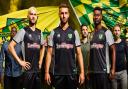 Norwich City trio, from left, Mario Vrancic, Ivo Pinto and Alex Tettey model Norwich City's new away strip, which was unveiled on Friday and will be given its first outing at Cambridge. Picture: Norwich City FC