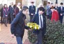 Waveney Youth Council representatives lay a wreath by the Kindertransport plaque at Lowestoft rail station.