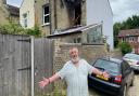 Ian Kirby, 80, pictured outside his home six months after his house went up in flames