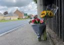 Flowers left at the scene of a fatal crash on the A12 in Wrentham