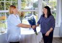 Zena Stotter presents Sue Plant with gifts on her work anniversary