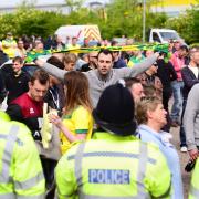 Norwich City V Ipswich Town derby at Carrow Road. Police hold back Norwich fans. Picture: DENISE BRADLEY