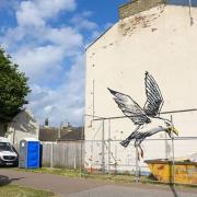 The Banksy seagull artwork prior to its removal from the end terraced house in Lowestoft.
