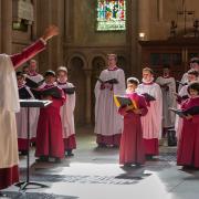 Choristers at Norwich Cathedral, conducted by master of music Ashley Grote.