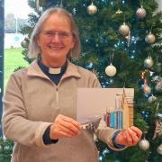 Rev Margaret Rittman, St Michael and All Angels Church, Martlesham, collecting her cards from East Suffolk House.