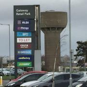 A large sign at the entrance of Gateway Retail Park in south Lowestoft is \