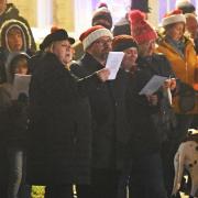 People enjoying the free outdoor Christmas carol concert in Lowestoft.