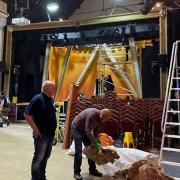 Theatre volunteers dismantling the temporary door partition immediately after the show run of Joseph in preparation for the installation of the new doors at the Players Theatre.