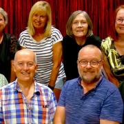 The Murder is Served cast, back row: Michelle Wilson, Wendy Takman, Toni Penson and Julia Rymer. Front row: Chris Moore, Andrew Liddon, Chris Darnell and Jon Marjoram.