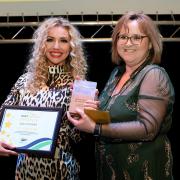 Ann-marie Doggett, of Magnus PR (left) collects her award. Picture: East Suffolk Awards