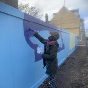 Colombian illustrator and visual artist Catalina Carvajal working on the brand-new mural in Kirkley, Lowestoft. Picture: Kirkley Pocket Parks Group