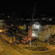 The large crane, lorry and workmen at the scene as part of the mural is removed. Picture: Oliv3r Drone Photography