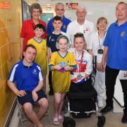 Some of the Suffolk swimmers including members of Team Waveney, officials, members of Lowestoft Lions and Team GB Paralympic team member Ellie Challis
