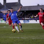 Kyle Haylock, blue, in action for Lowestoft. Picture:  Shirley D Whitlow