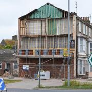 The wall of a house is being rebuilt after a Banksy mural was removed. Picture: Mick Howes