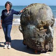 Genevieve Christie, Chief Executive Officer at First Light Festival CIC with the Chthonic Head on Lowestoft's South Beach. Picture: Mick Howes