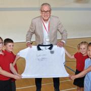 Terry Butcher with a signed replica 1990 England World Cup shirt in the Terry Butcher Sports Hall. Picture: Mick Howes
