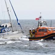 Lowestoft lifeboat tows the yacht to safety. Picture: Mick Howes