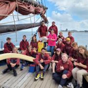 Alderman Peel High School  students with the crew aboard Excelsior. Picture:  The Excelsior Trust