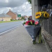 Flowers left at the scene of a fatal crash on the A12 in Wrentham