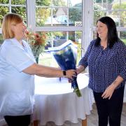 Zena Stotter presents Sue Plant with gifts on her work anniversary