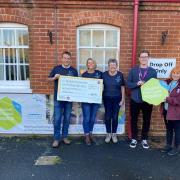 The funds are handed over to the hospice charity
