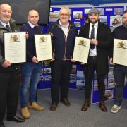 Lowestoft Lifeboat crew members collecting their awards from Richard Musgrove. L-R: Andrew Smith, James Tacon, Richard Musgrove, Ben Arlow and Michael Beadle. Picture: Mick Howes