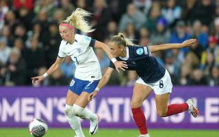 England’s Chloe Kelly, left, and Scotland’s Samantha Kerr battle for the ball in September’s meeting (Owen Humphreys/PA)