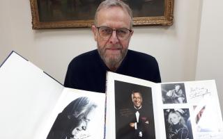 Rob French, ephemera valuer at Richard Winterton Auctioneers, with signatures from Jack Lemmon and Frank Sinatra that featured in the auction. Picture: Richard Winterton Auctioneers