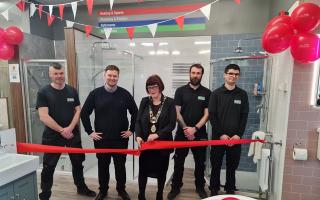 Staff from Graham The Plumbers' Merchant in Lowestoft with the mayor, Sonia Barker, at the official unveiling of the new showroom.