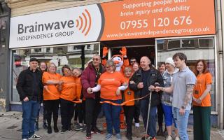 Service users cut the ribbon to mark the official opening of the new Brainwave Independence Group - Brain injury and disability support charity shop on London Road North, Lowestoft. Picture: Mick Howes